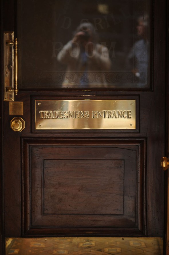 DS & CJ reflected in the tradesmens' entrance, Rules restaurant,